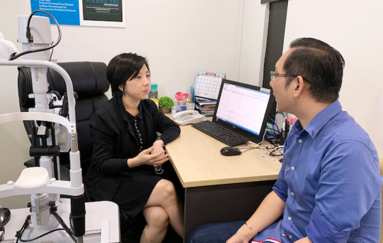 eye surgery doctor explaining to customer's concerns